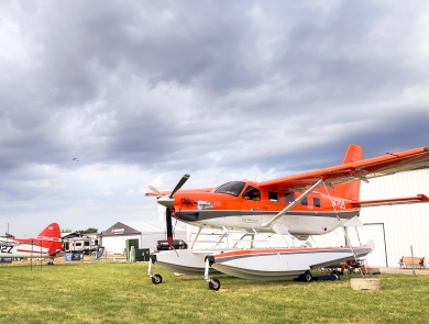 Migratory Bird Program Daher Kodiak survey plane in front of the International Federal Pavilion at EAA AirVenture convention