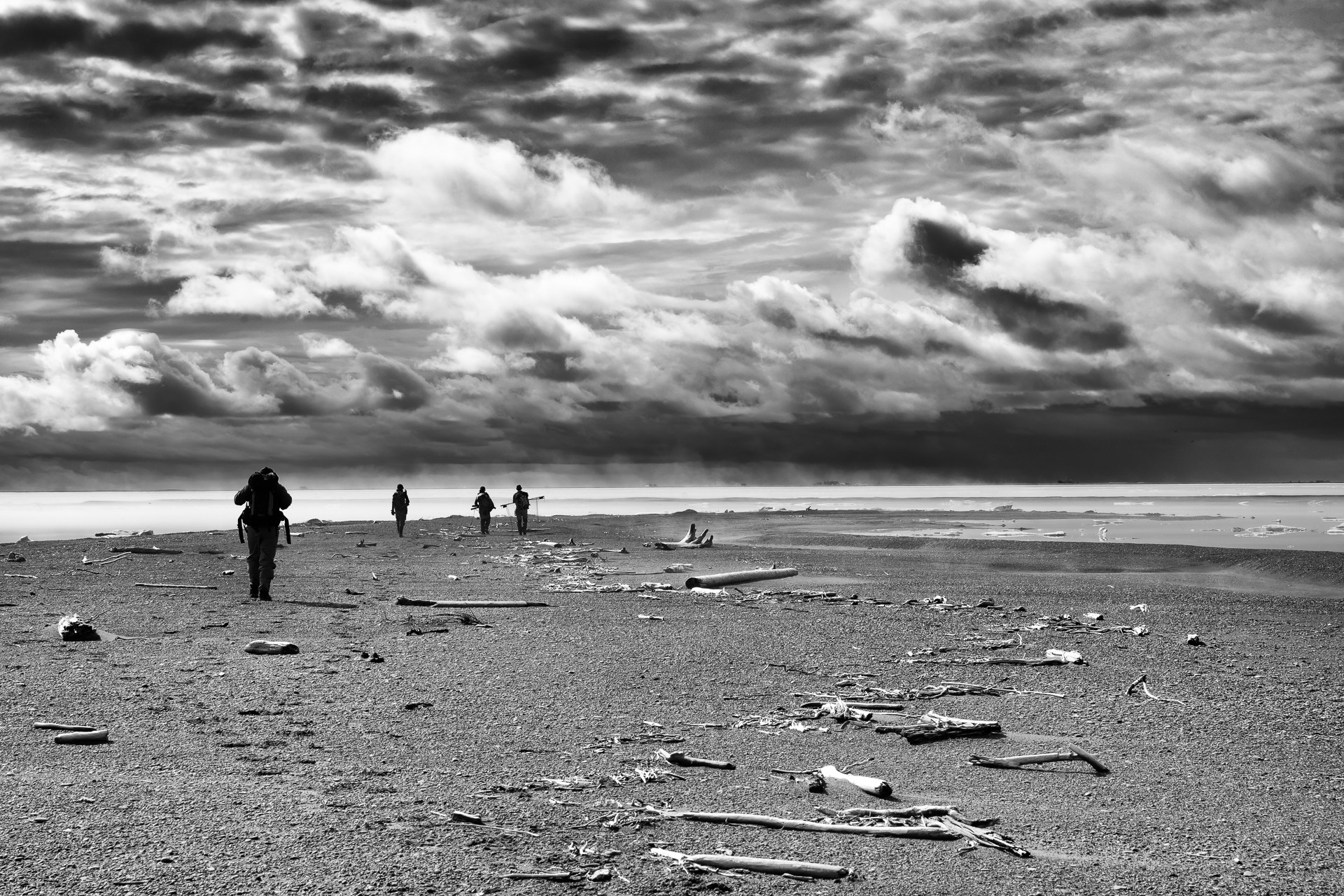 Researchers walk along a barrier island on the Arctic Coast | FWS.gov