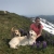 woman on a ridge with dogs