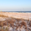A white sand beach alongside the Gulf