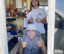 Image of two interns in a gatehouse window