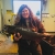 Adult Chinook salmon being held by a woman. 