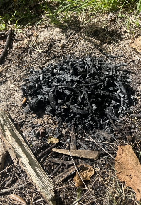 Discarded charcoal abandoned along the beach at Guam National Wildlife Refuge