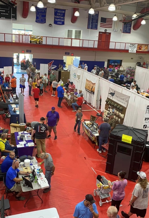 Aerial view of event booths set up in gym