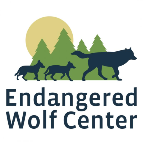 Logo of the Endangered Wolf Center featuring a trio of wolves set against a forest and moon