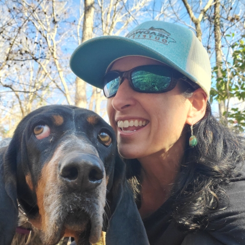 Alice on a hike with her dog