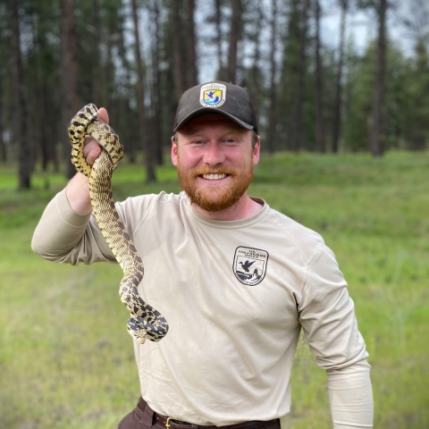 Thurman Johnson holding a gopher snake