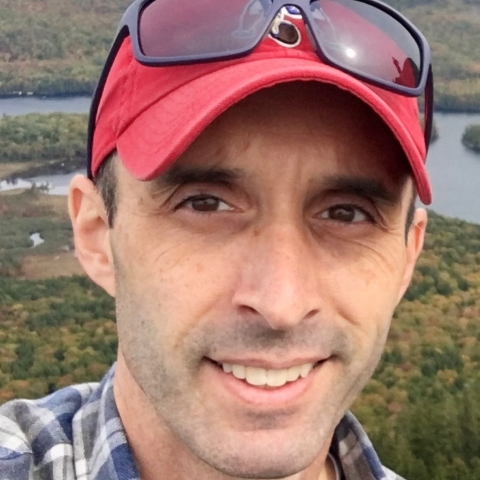 Headshot of smiling man.