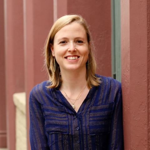 Amanda smilesin a blue stripped blouse 