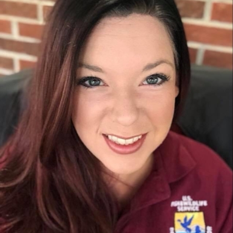 Headshot photo of Ashton Jones wearing a maroon Fish and Wildlife Service polo by Ashton Jones/USFWS.