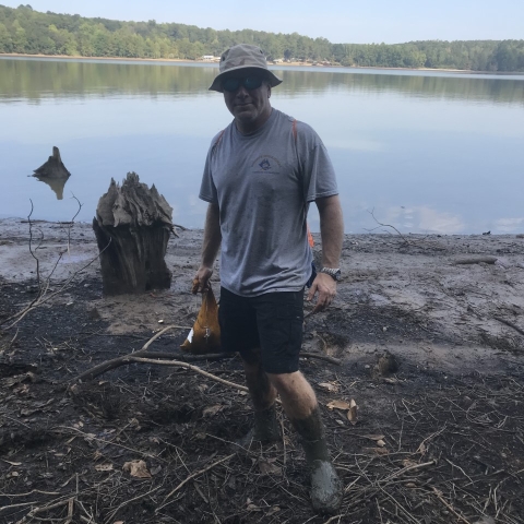 Clint looking for mussels at Gantt Lake