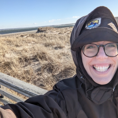 Image of park ranger in field.