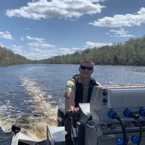 Jorge Buening driving a boat.