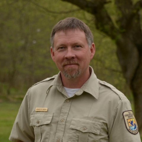 An image of a staff member standing outside.