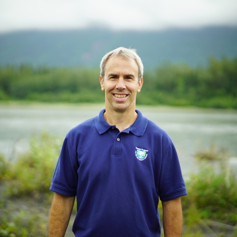 man standing by river bank