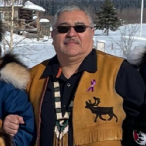 USFWS, Alaska Region Indigenous Knowledge Liaison, George Yaska, posing outdoors with snow covered grounds.