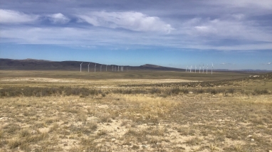 wind turbines in background of rocky Wyoming plains