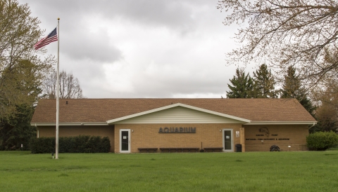 The exterior of the aquarium building on a spring day.