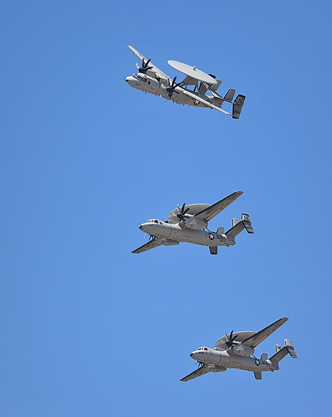 Three aircrafts flying in the sky.