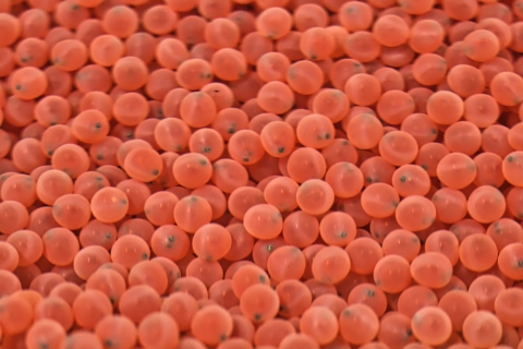 A large collection of tiny pink spheres