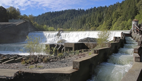 water flowing over a dam