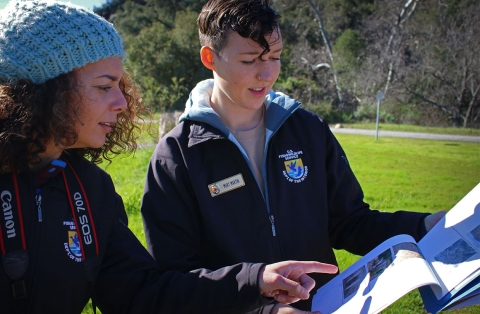 Two women looking at document