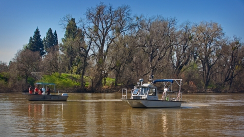 Two motored boats on a river