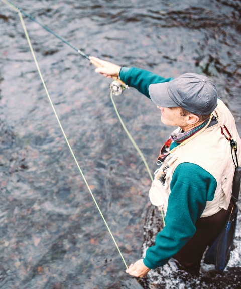 fisherman fly fishing.
