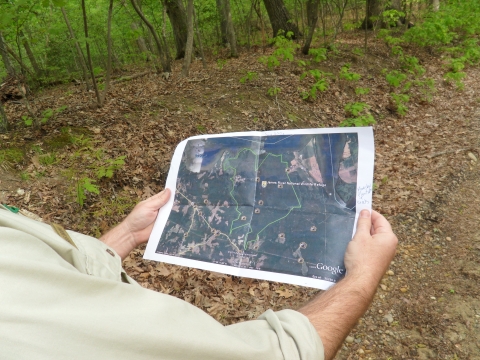 staff holding map of James River NWR