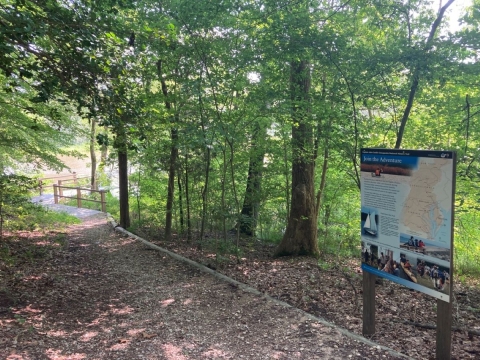 hiking trail along creek and sign