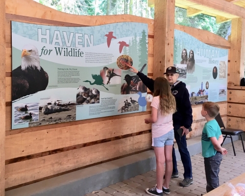 A Refuge Volunteer Discusses Refuge Wildlife With Young Visitors