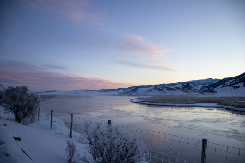 Sunrise over a frozen pond