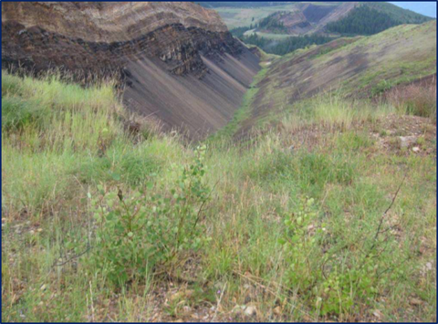 A close-up view of an open pit mine.