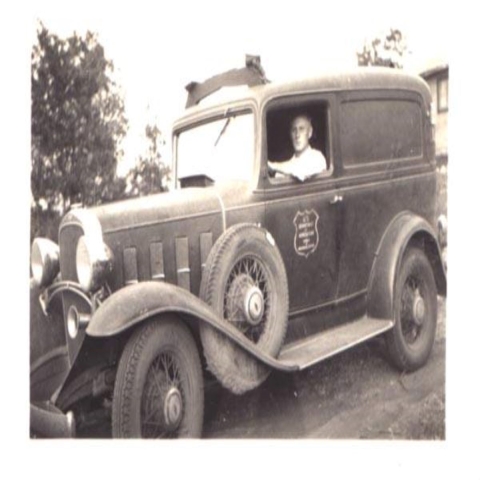 Trempealeau National Wildlife Refuge first refuge manager Harvey Neilson driving a Service vehicle 