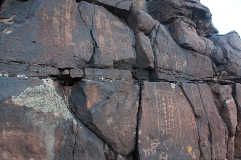 Centuries-old images etched onto a steep rock face