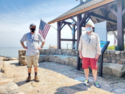 Volunteers await the arrival of visitors at Outer Island