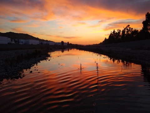 Sunset over rippled water