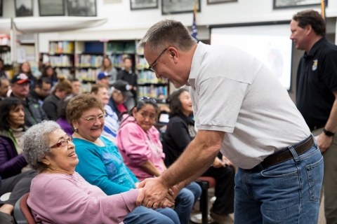 Greg Siekaniec gives a warm handshake to 90 year old internment survivor Haretina Krukoff following the USFWS’s apology 