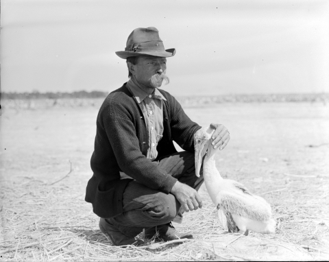 man (Paul Kroegel) kneeling