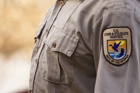 Close up of a USFWS patch on a uniform shirt