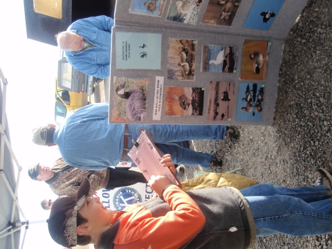 photo of junior hunter writing down answers to bird id game