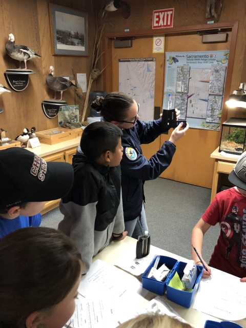 ranger showing student water chemistry test results