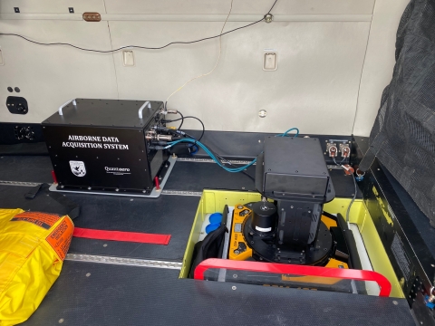 This thermal sensor mount and head (right) leads to computing system that stores and processes imagery in-flight (left).