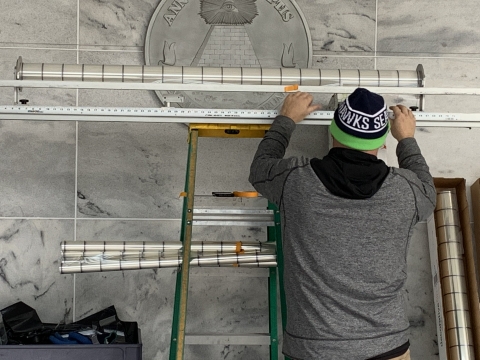 Installation of the bird-friendly glass on the 911 Federal Building