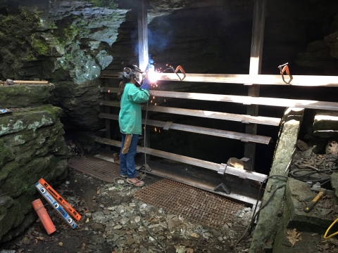 Welding cave gate at Devil's Den State Park