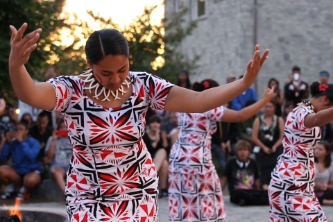 Three American Samoa students performing a traditional dance circle