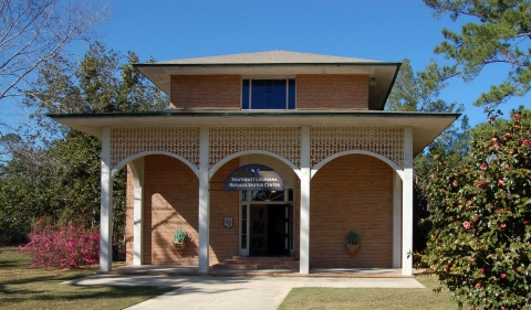 Building with walkway leading to a porch 