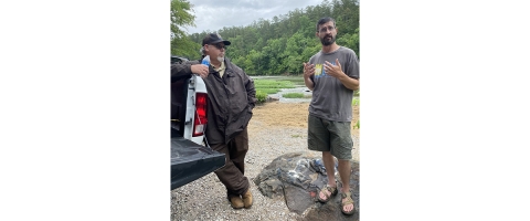 Two men alongside Cahaba River.