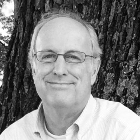 head shot of man with glasses