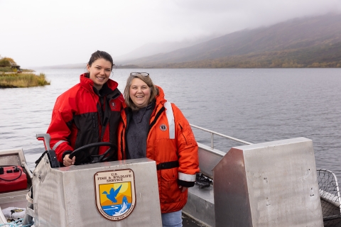 two woman in a USFWS skiff